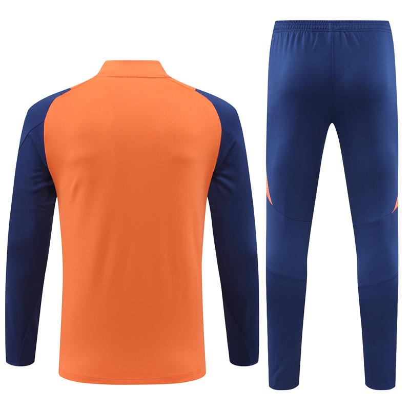 Ensemble de survêtement Manchester United Half-Zipper "Orange & Blue " 2024/2025